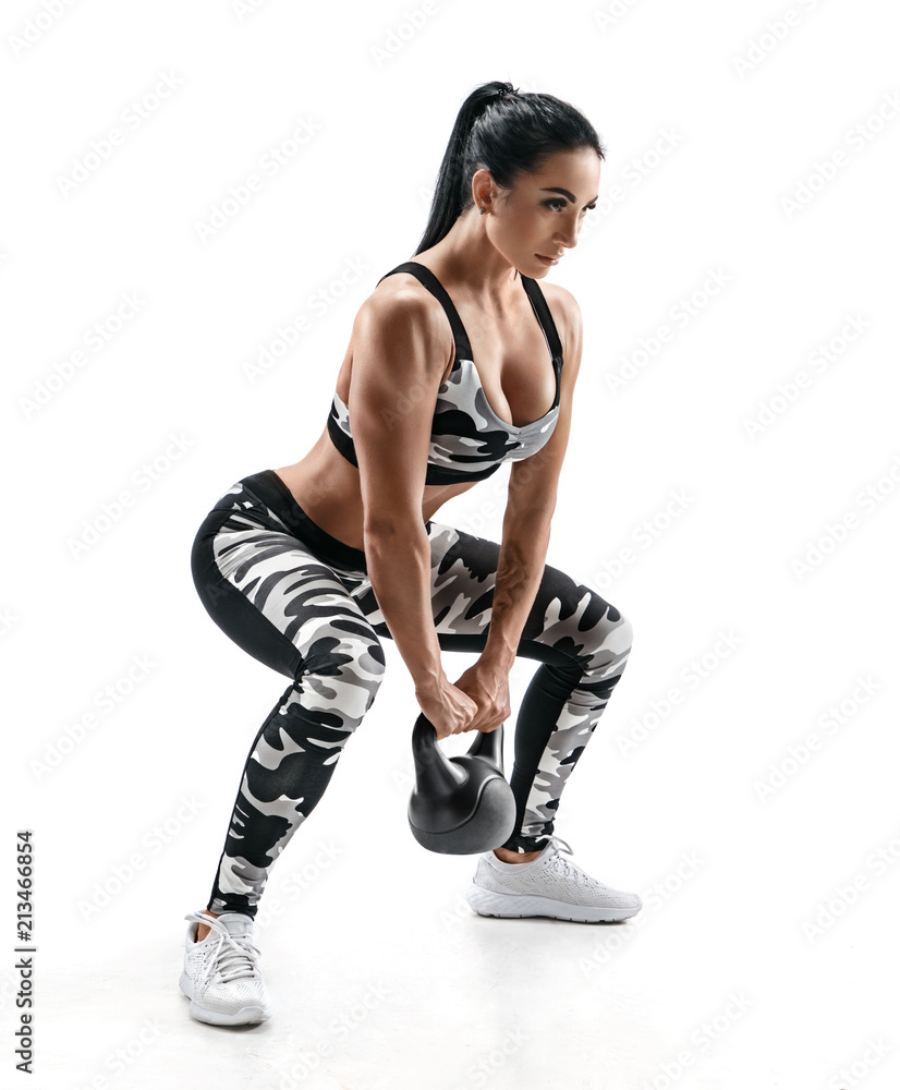 Sporty woman doing squats with kettlebell. Photo of muscular fitness model  in military sportswear isolated on white background. Strength and  motivation Stock Photo | Adobe Stock