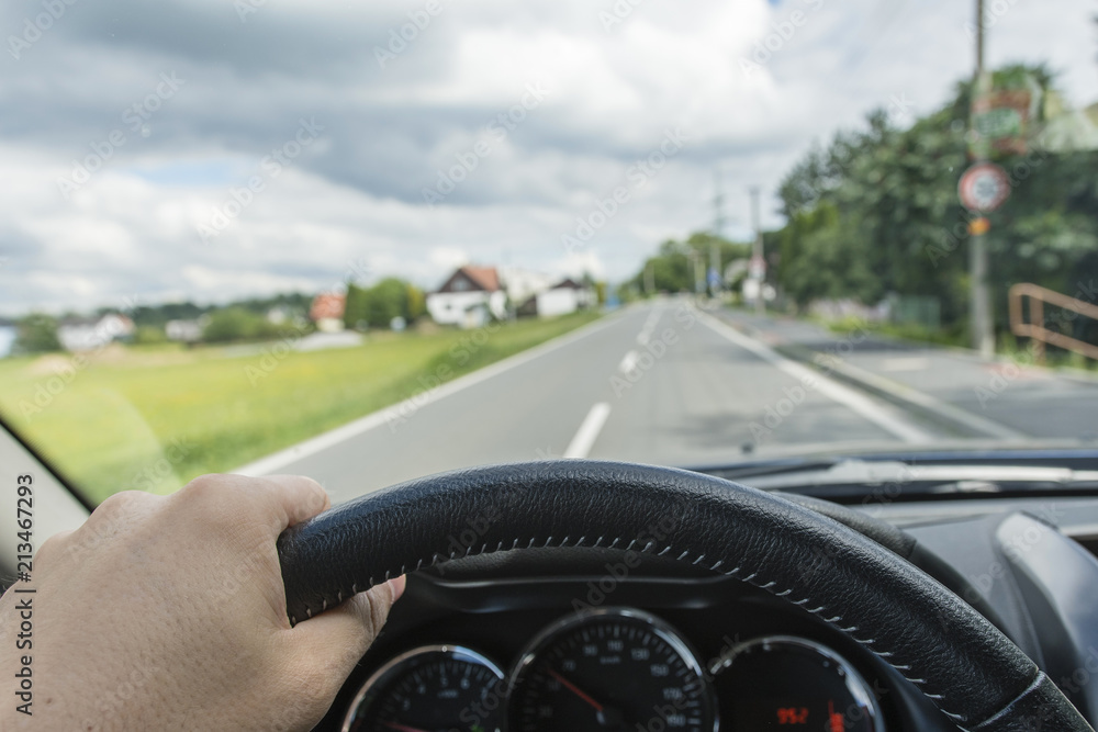 Driving a car on the road from the driver's point of view. Driving a car on the road from the driver's point of view.