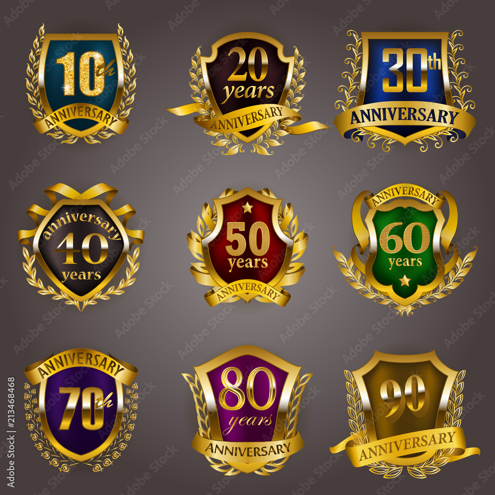 Set of gold anniversary badges with laurel wreaths, shield, numbers. Decorative emblem of jubilee on gray background. Filigree element, frame, border, icon, logo for web, page design in vintage style