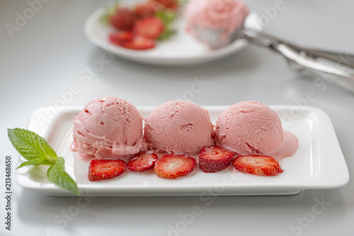Tasty creamy strawberry ice cream with fresh ripe red succulent fruit 