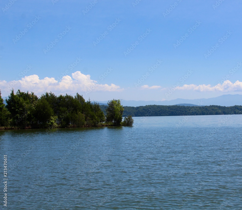 The lake on a beautiful sunny day in the summer months.