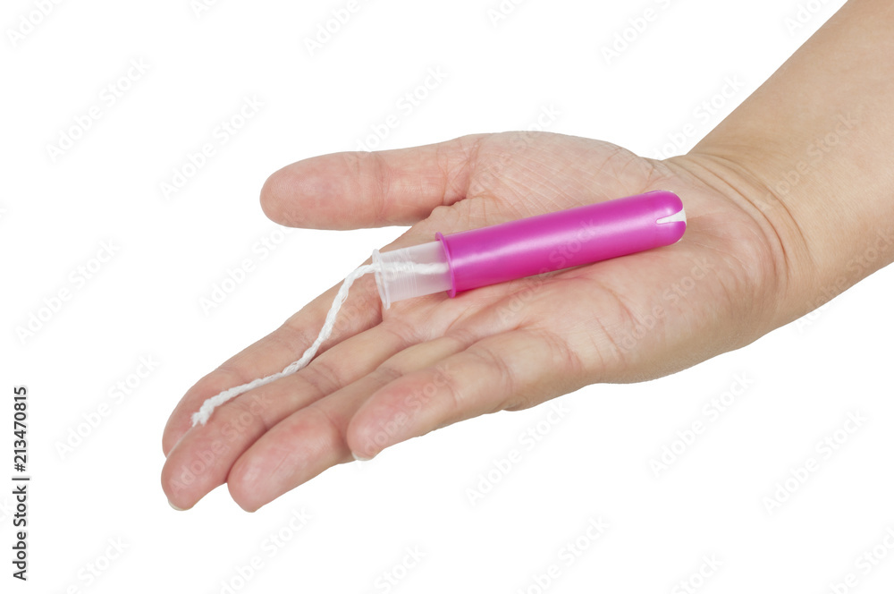 female hand holds a tampon with applicator isolated on white female hand holds a tampon with applicator isolated on white