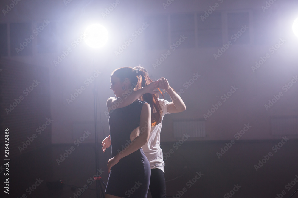 Young couple dancing latin dance Bachata, merengue, salsa. Two elegance pose in dance class Young couple dancing latin dance Bachata, merengue, salsa. Two elegance pose in dance class
