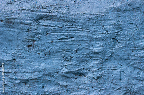 texture of a rough painted surface of blue color