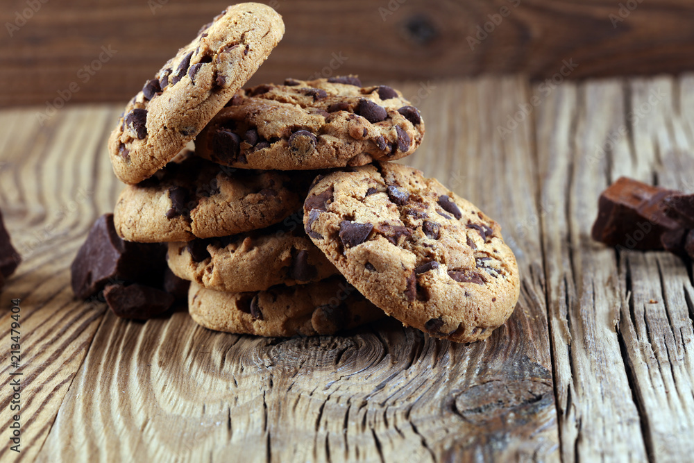 Chocolate cookies on table. Chocolate chip cookies shot with chocolate Chocolate cookies on table. Chocolate chip cookies shot with chocolate