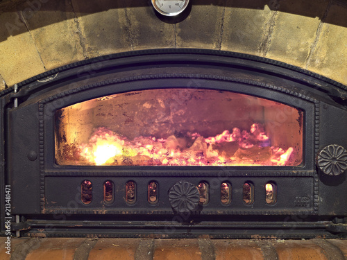 Traditional Finnish wood burning oven with a glass door. These are used for heating and cooking and baking.