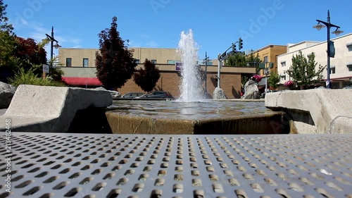 Urban water park with water fountain trees and blue sky shot in summer or spring 1920 x 1080 24 frp photo