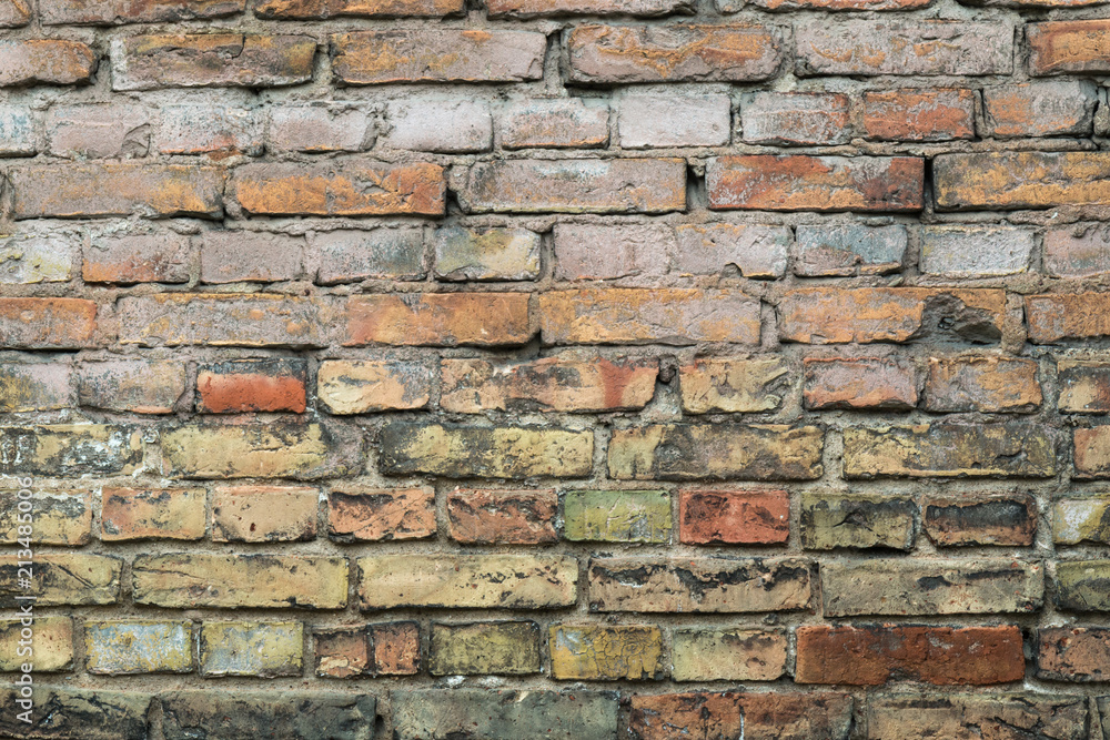 Background of the old colorful bricks wall 
