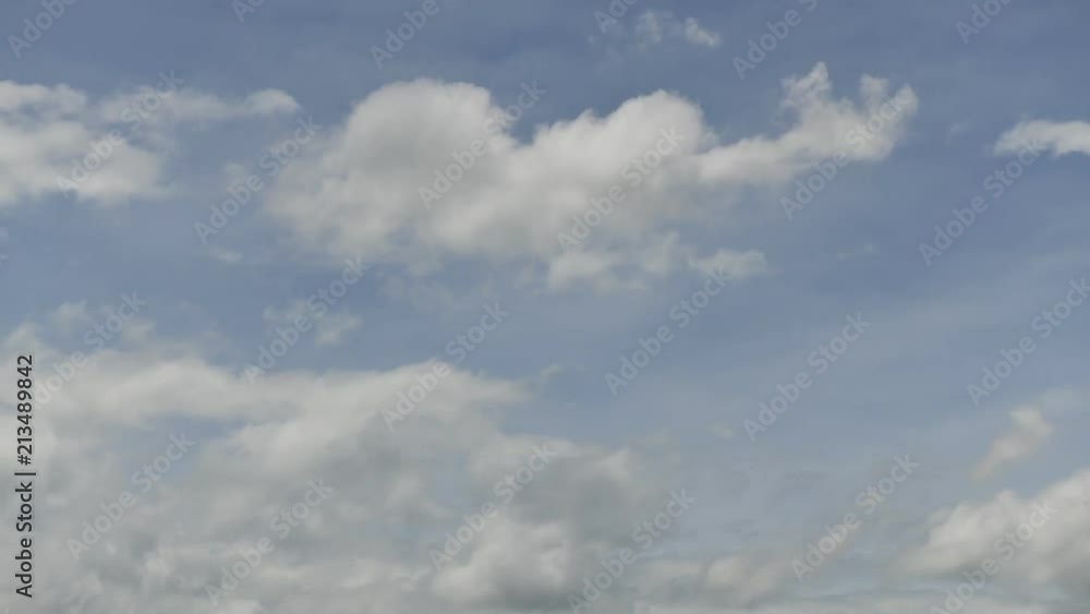 Time lapse clip of white fluffy clouds over blue sky Time lapse clip of white fluffy clouds over blue sky