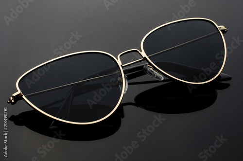sunglasses cat's eye in metal frame isolated on black