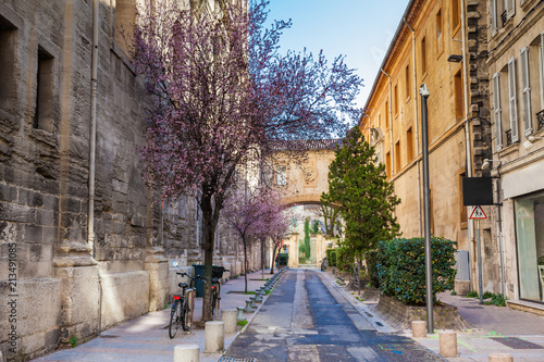 Fotografie Two bicycles parked on the Rue Frederic Mistral at the walled city of Avignon