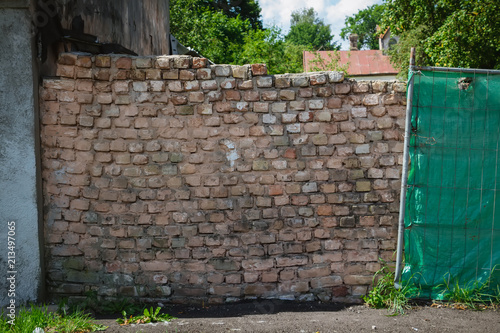 An old poorly built duct brick wall