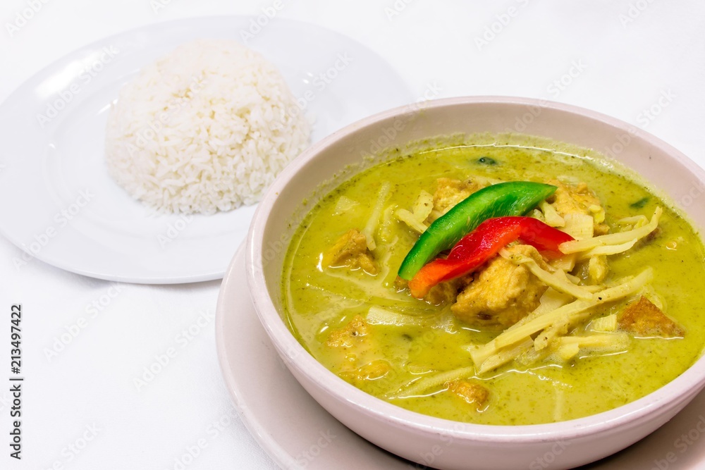 Green curry chicken served with steamed white rice Green curry chicken served with steamed white rice
