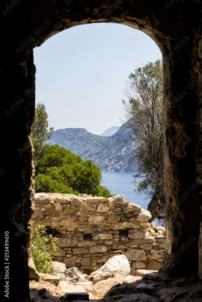 Mediterranean landscape from the window of a ruined old castle. Framing