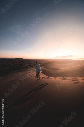 Girl walking into the sunse...