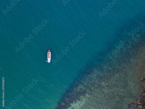 Small boats fishing in the blue ocean © obeyleesin
