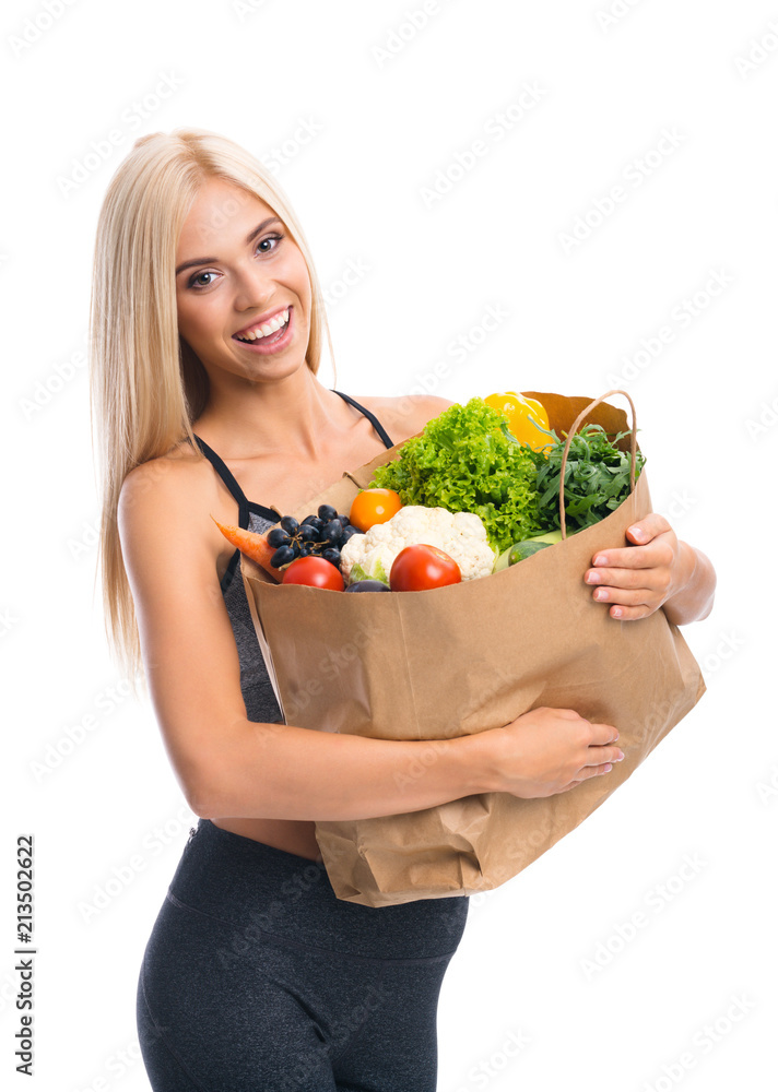 Woman in fitness wear with vegetarian food Woman in fitness wear with vegetarian food