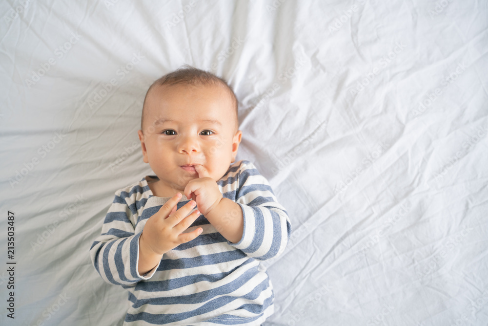 The little boy in the bedroom in bed. The little boy in the bedroom in bed.