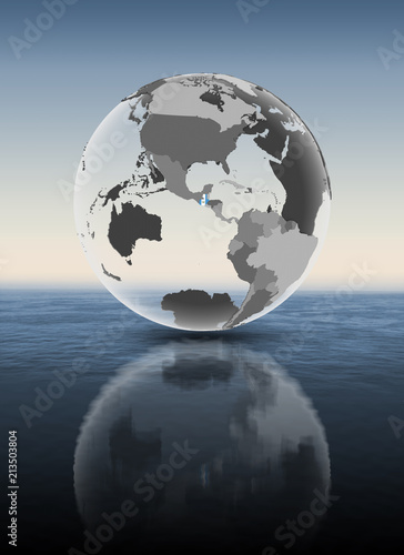 Fototapeta Naklejka Na Ścianę i Meble -  Guatemala on translucent globe above water