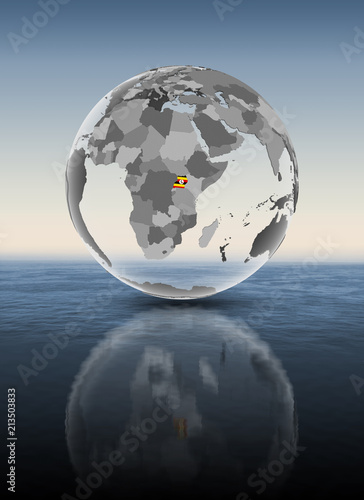 Fototapeta Naklejka Na Ścianę i Meble -  Uganda on translucent globe above water