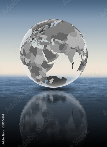 Qatar on translucent globe above water