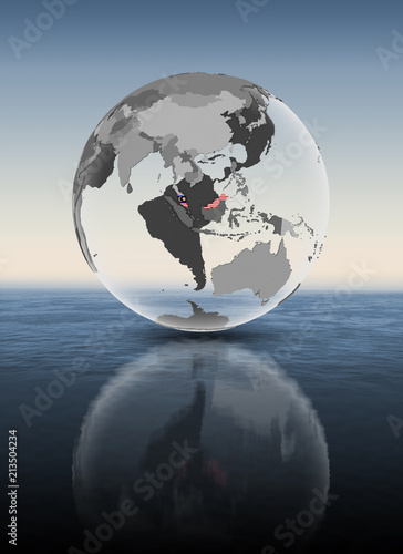 Malaysia on translucent globe above water