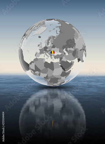 Romania on translucent globe above water