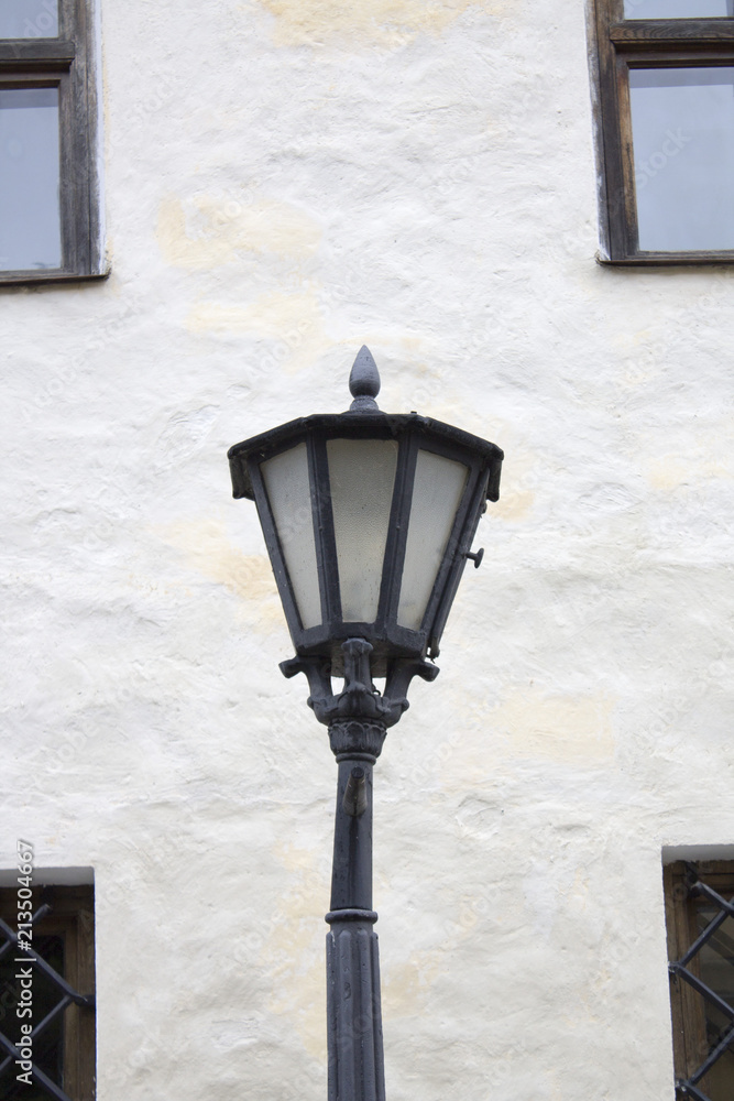Photo of vintage Old Street Classic Iron Lantern On The House Wall, Close Up