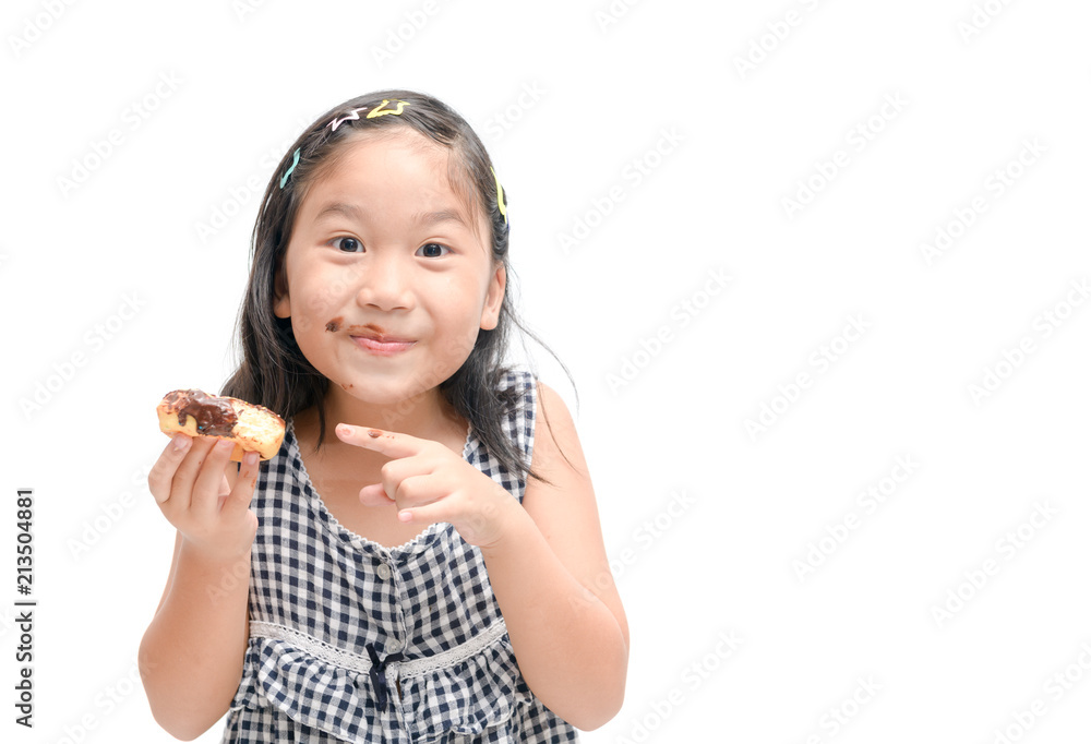 Little happy cute girl is eating donut isolated Little happy cute girl is eating donut isolated