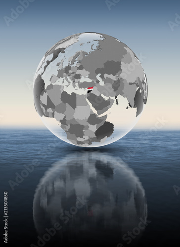 Fototapeta Naklejka Na Ścianę i Meble -  Syria on translucent globe above water