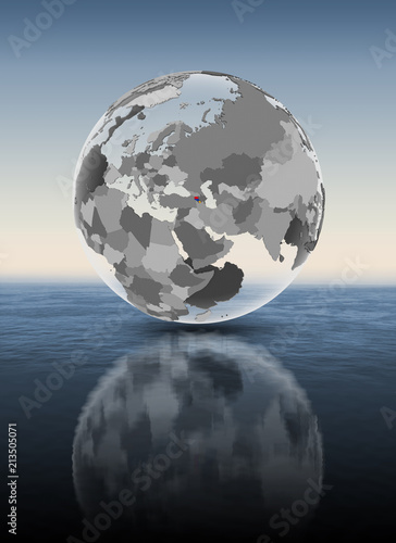 Armenia on translucent globe above water