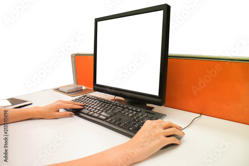 woman using computer at desk in office