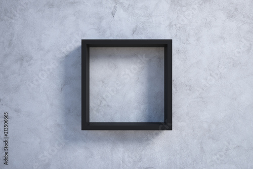 black picture frame on concrete wall