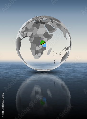 Fototapeta Naklejka Na Ścianę i Meble -  Tanzania on translucent globe above water