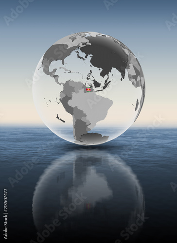 Suriname on translucent globe above water