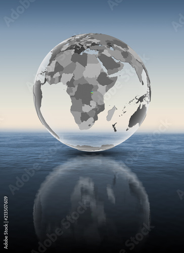 Fototapeta Naklejka Na Ścianę i Meble -  Rwanda on translucent globe above water