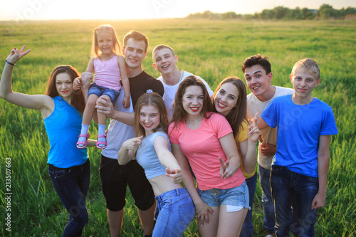 Group of young people on the field © Evgenia Tiplyashina