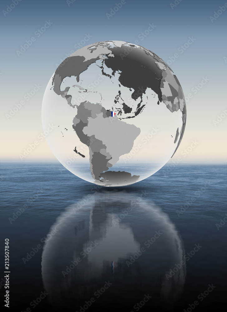 Fototapeta premium French Guiana on translucent globe above water