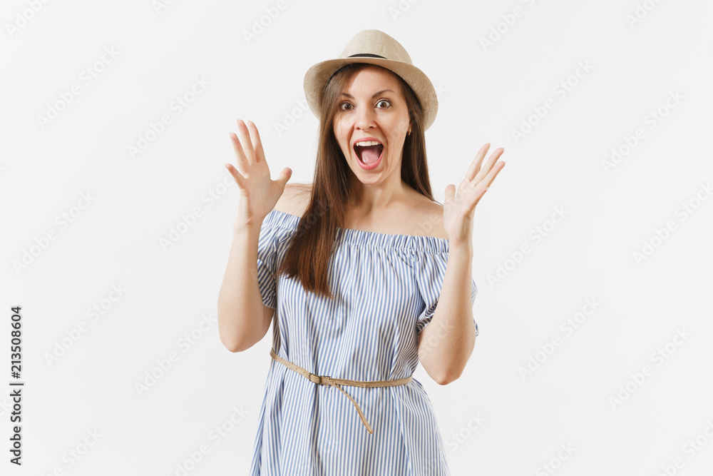 Young fun overjoyed woman in blue dress, hat keeping mouth wide open, looking surprised, posing isolated on white background. People, sincere emotions, lifestyle concept. Advertising area. Copy space. Young fun overjoyed woman in blue dress, hat keeping mouth wide open, looking surprised, posing isolated on white background. People, sincere emotions, lifestyle concept. Advertising area. Copy space.