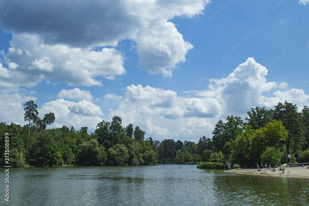 Forest lake against a beautiful sky background. Forest lake against a beautiful sky background.