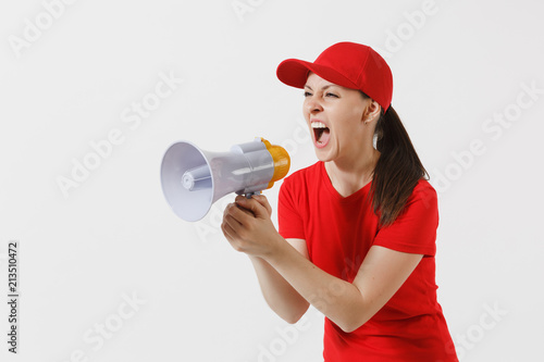 Delivery woman in red uniform isolated on white background. Female in cap, t-shirt working as courier screaming in megaphone hot news. Fun girl announces discounts sale. Copy space for advertisement.