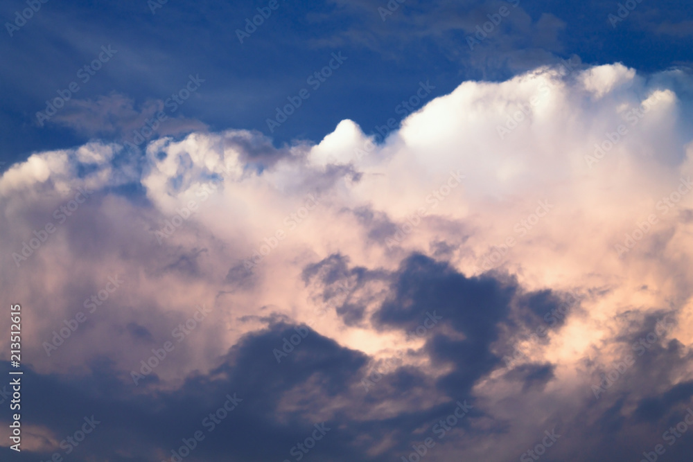 Blue-pink clouds before a thunder-storm. Background of the sky in dark storm clouds.