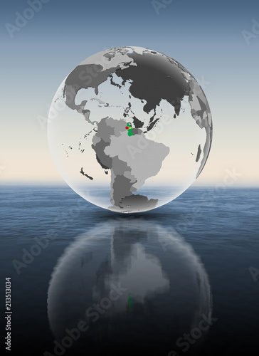 Fototapeta Naklejka Na Ścianę i Meble -  Guyana on translucent globe above water