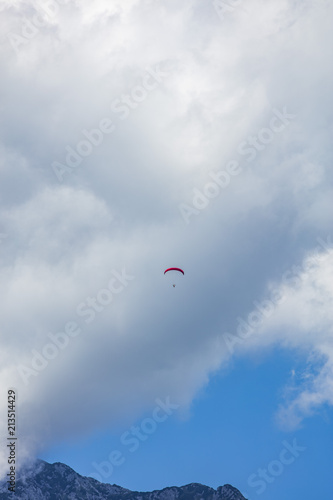 paraglider in the blue clouds 