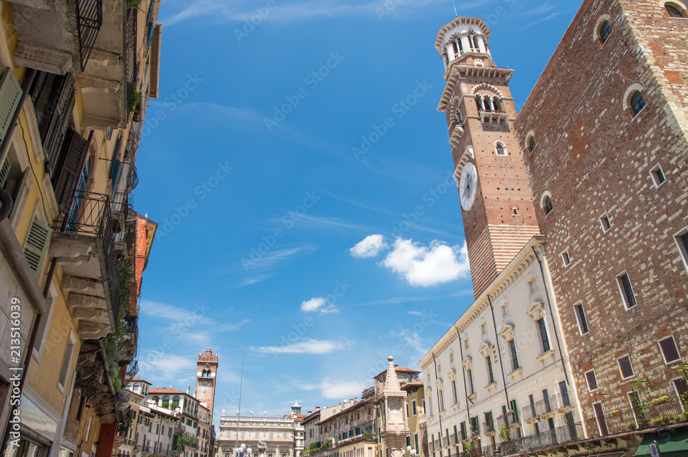 A street view toward Piazza delle Erbe and Lamberti tower in Verona