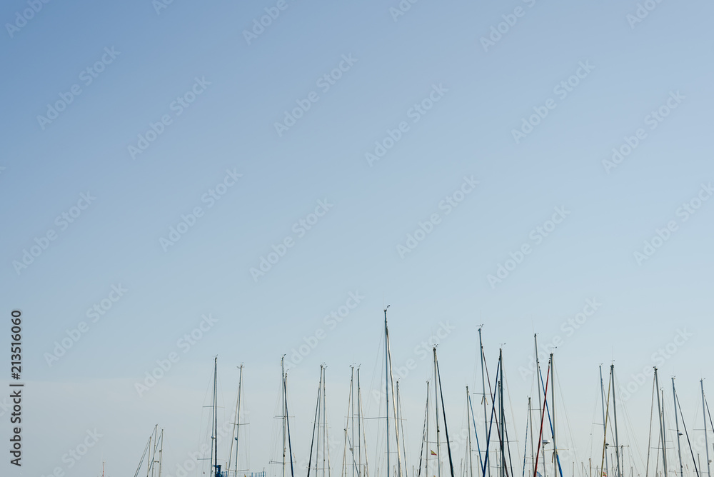 Masts of boats moored in their marina Masts of boats moored in their marina