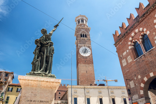 A street view of Piazza delle Erbe and Lamberti tower in Verona photo