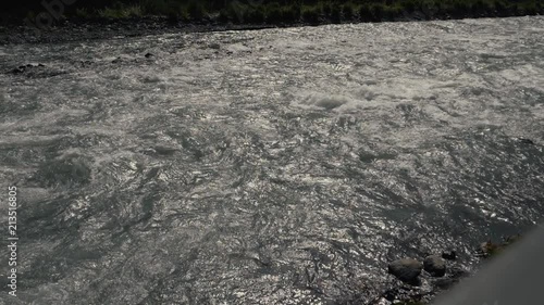 Mountain clean river. Cold fast river slow motion video photo