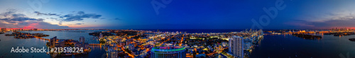 Aerial panorama Miami Beach twilight with neon city lights