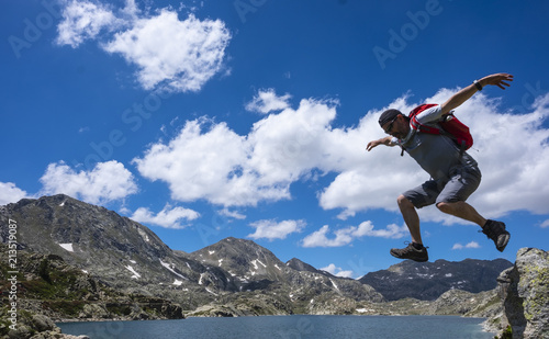 Man doing sport in the Estany tort, national park of AigÃ¼estortes and Lake San Mauricio, Lleida © poliki